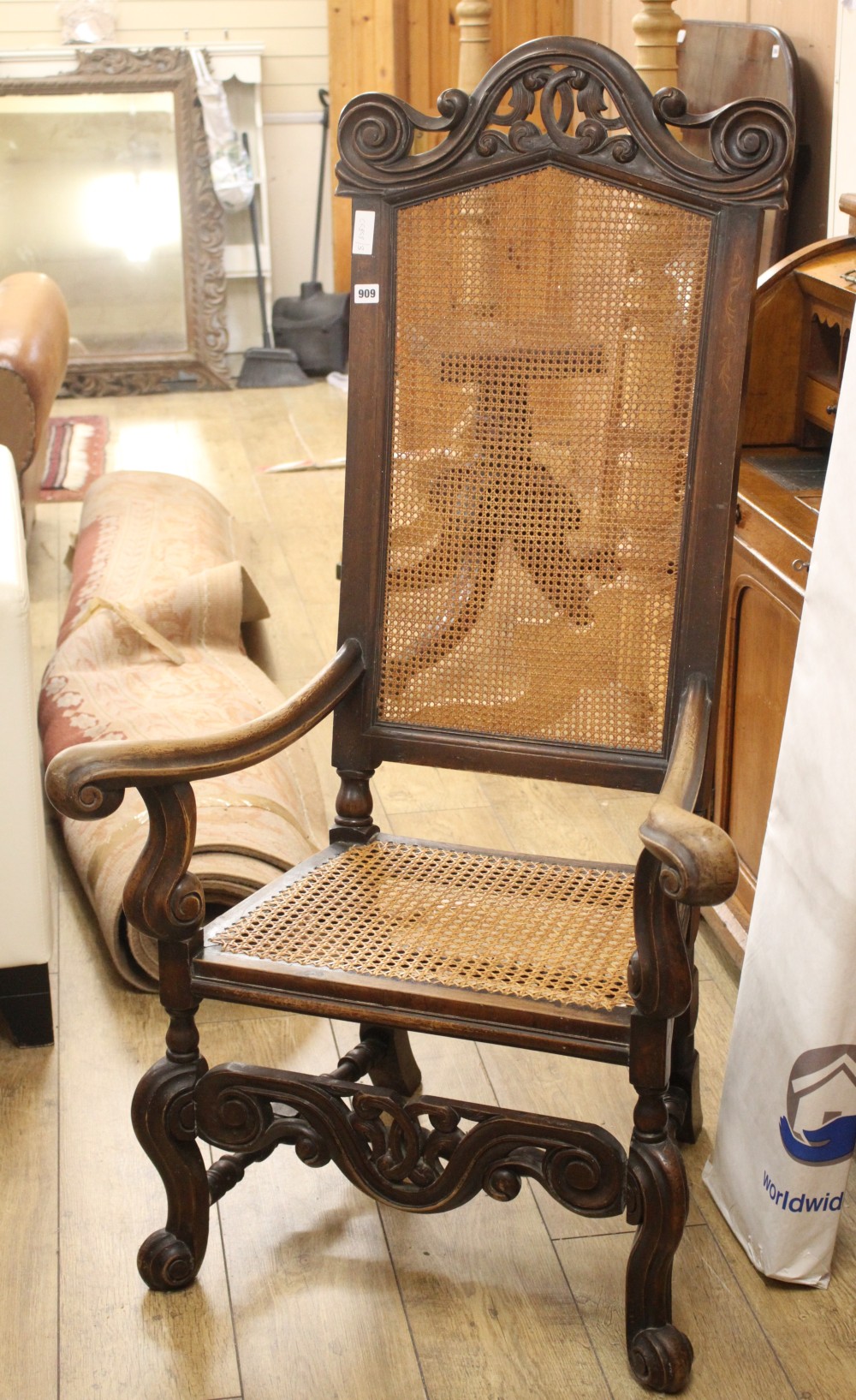 An 18th century style caned elbow chair, W.72cm D.60cm H.134cm